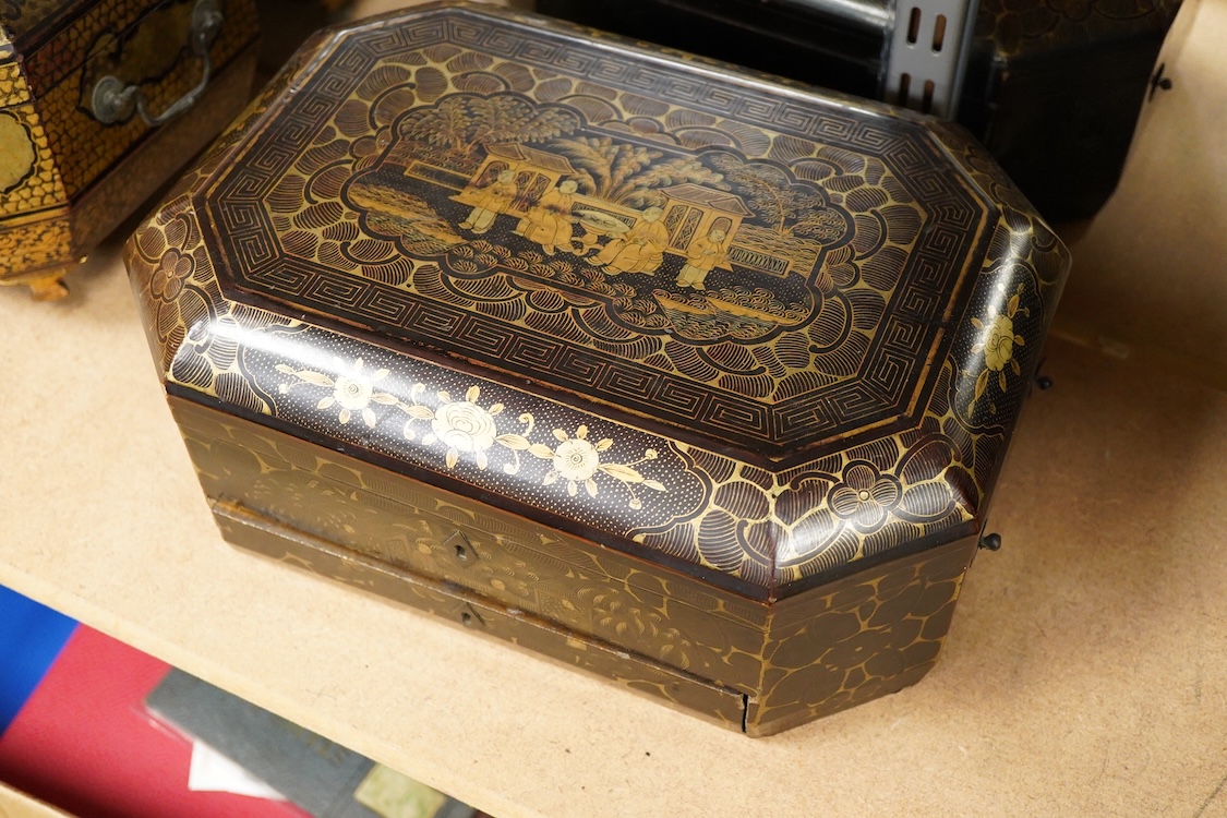 Three 19th-century Chinese gilt-decorated black lacquer sewing boxes, two containing bone sewing accessories, together with a similar tea chest (4) largest box- 33.3cm wide x 20cm high